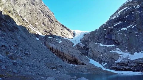 Front view of briksdal glacier in Norway with frozen ice lake 動画素材 90728438