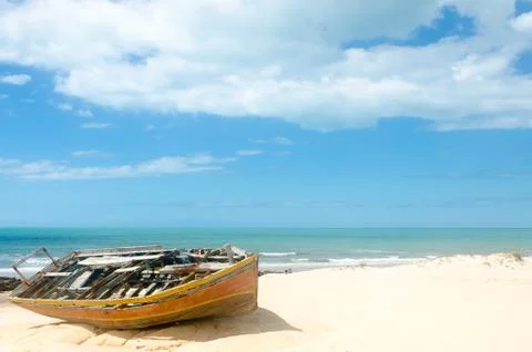 Front view of a broken canoe over the sand Stock Photos