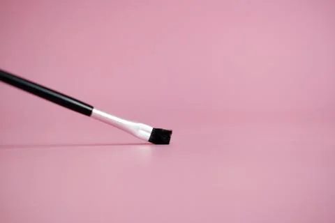 Front view brush makeup tools with pink pastel background Stock Photos