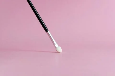 Front view brush makeup tools with pink pastel background Stock Photos