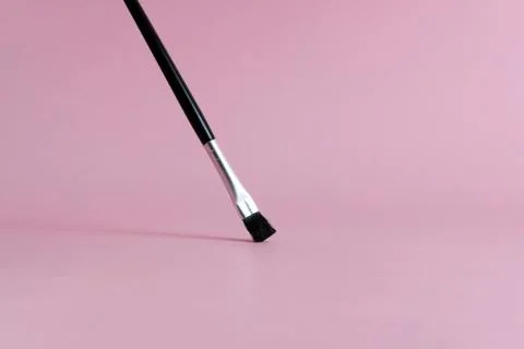 Front view brush makeup tools with pink pastel background Stock Photos