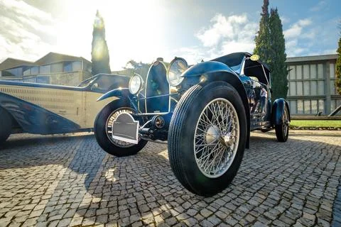 Front view of Bugatti Type 40 on cobblestone drive on sunny day Stock Photos