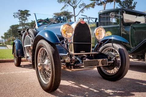Front view of Bugatti Type 40 on cobblestone drive on sunny day Stock Photos