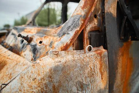Front View of a Burnt Out Delivery Van with Rusty Hood Фото