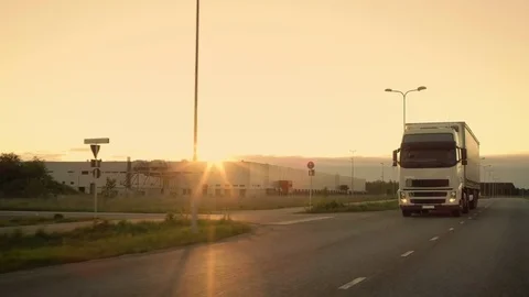 Front-View Camera Follows Semi-Truck with Cargo Trailer Driving on a Highway.  Stock Footage 78672310