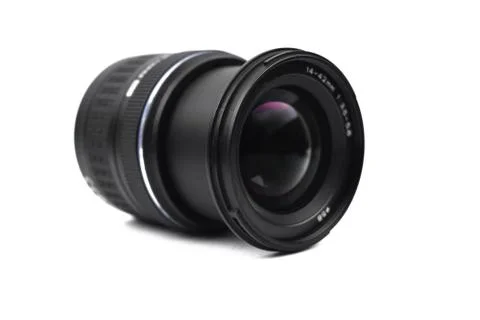 Front view of a camera lens of black color placed on an isolated empty white Foto stock
