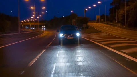 Front view of a car driving at dusk Video stock 104318172