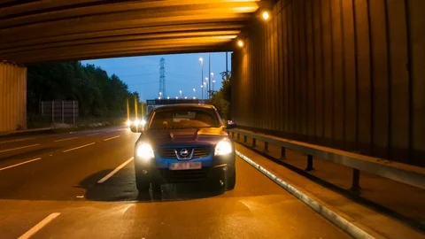Front view of a car driving at dusk Video stock 104320620