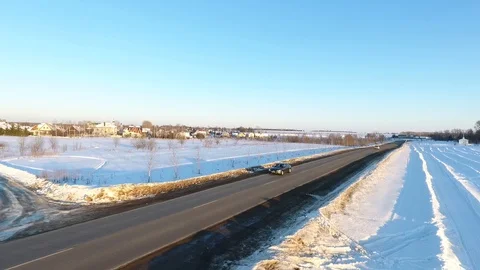 Front view from car mounted camera when vehicle driving winter snowy forest road Stock Footage 104576445