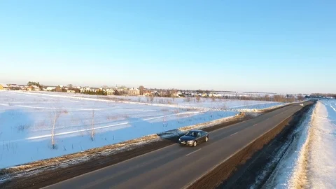 Front view from car mounted camera when vehicle driving winter snowy forest road 库存影片 104576475