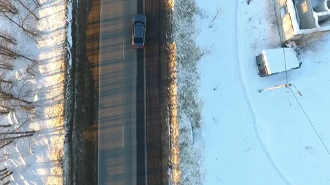Front view from car mounted camera when vehicle driving winter snowy forest road Stock Footage 104576595