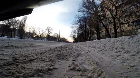 Front view of the car riding on snow covered road Stock Footage 60632785