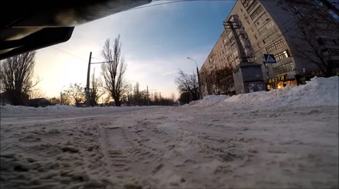 Front view of the car riding on snow covered road Stock Footage 60632813