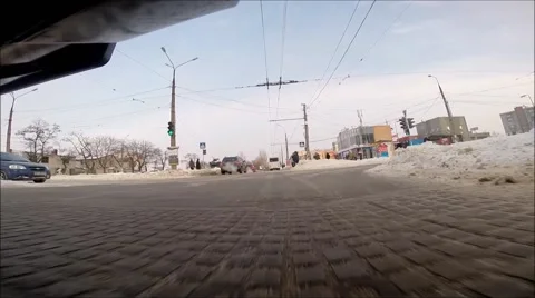 Front view of the car riding on snow covered road Stock Footage 60633428