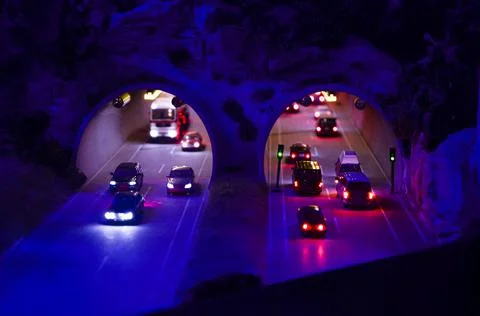 Front view of car traffic on mountain tunnel Stock Photos