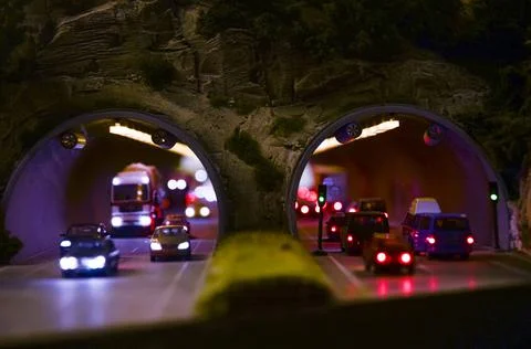 Front view of car traffic on mountain tunnel Stock Photos