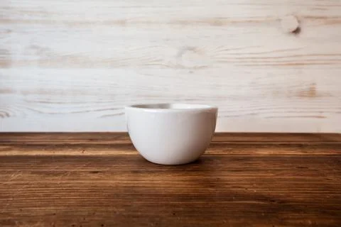 Front view of ceramic bowl on rustic table wooden background with Copy Space  Stockfoto's