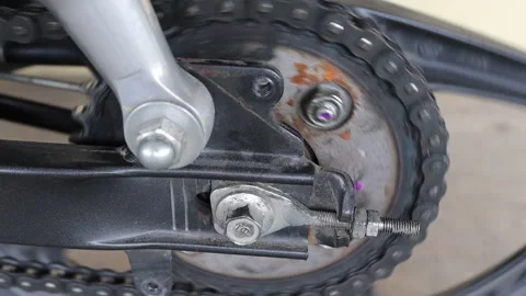 Front view for chain and sprocket of motorcycle rear wheel spinning Stock Footage 150470133