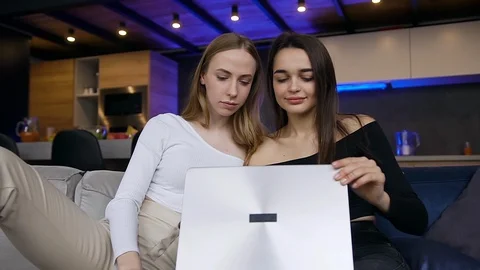 Front view of cheerful attractive positive young women which having video call Stock Footage 127096385