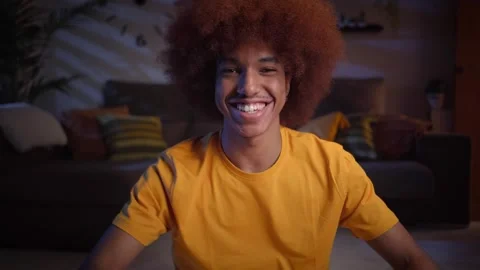 Front view cheerful young afro man making video call in living room. Smiling Stock Footage 251380650