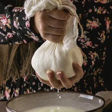 Front view cheese making process Stock Photos