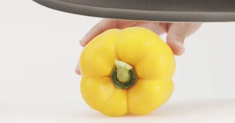 Front view, The chef begins to cut the yellow bell peppers. Stock Footage 167247654