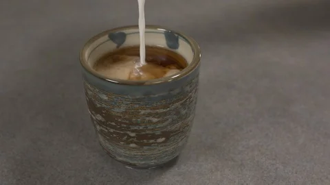 Front view - chef pouring cream in a Japanese tea cup 4k. Stock Footage 96145309