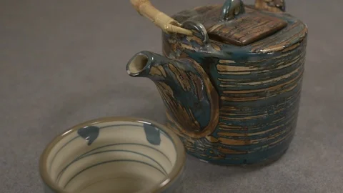 Front view - chef pouring hot water in a Japanese tea pot 4k. Stock Footage 96142135