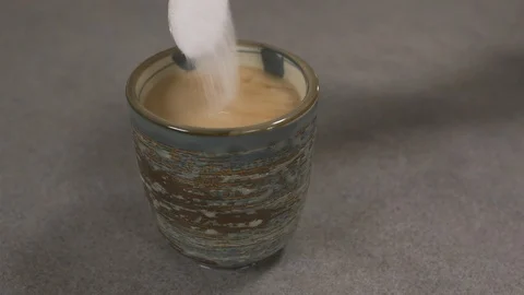 Front view - chef pouring sugar in a Japanese tea cup 4k. Stock Footage 96145625