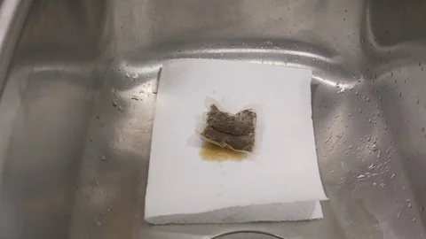 Front view-chef throwing out tea bag in the sink 4k Stock Footage 96138809