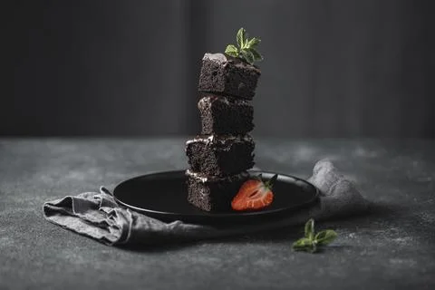 Front view chocolate cake pieces plate with mint Stock Photos