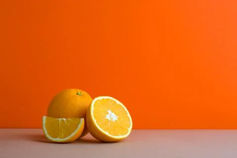 A front view of citrus in orange background Stock Photos