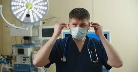 Front view close up of a Caucasian surgeon male healthcare worker in a hospital Stock Footage 151450707