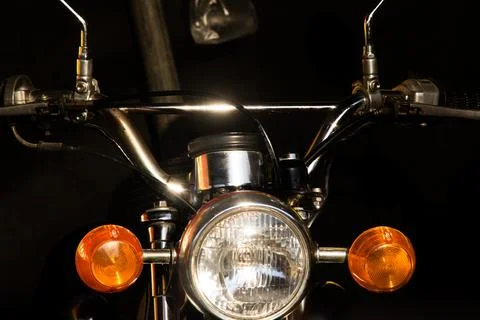 Front view close up of classic vintage motorcycle chrome handlebar round he.. Stock Photos