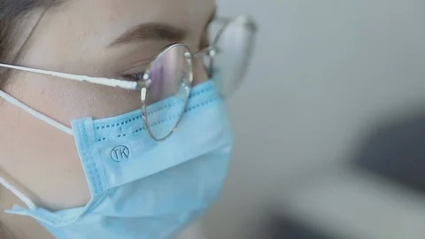 Front view close up of a female in glasses healthcare professional wearing a  Vídeo Stock 127166005