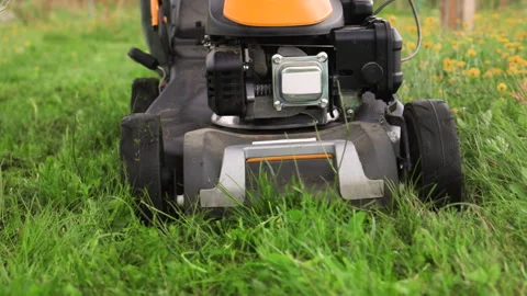 A front view close up of a wheeled lawn mower. Stock Footage 315906307