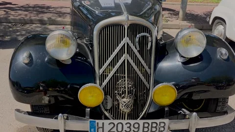 Front view closeup of a rare classic vintage black Citroen Traction Avant co Stock Footage 337589701