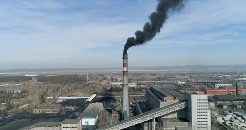 Front view of coal-fired plant smokestack emits black smoke Air pollution Stock Footage 106619298