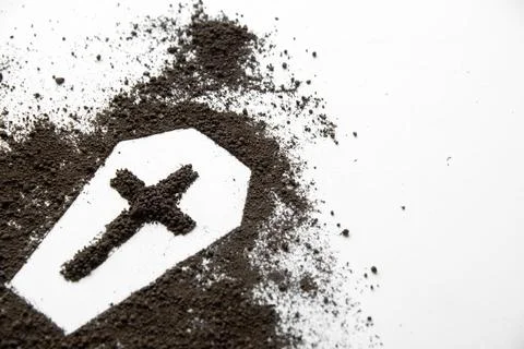 Front view of coffin shape with dark soil and cross on white surface death .. Stock Photos