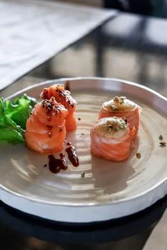 Front view on cold gunkan with salmon and cream. Japanese food style. Gunkan set Stock Photos
