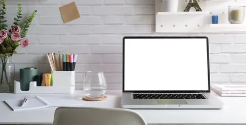 Front view of comfortable working space with laptop computer, books and sta.. Stock Photos