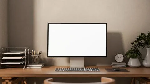 A front view of a computer and decorative plants on a hardwood desk against.. Illustrazione stock