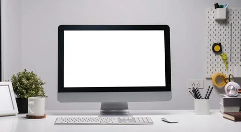 Front view computer with empty display and coffee cup on white table.. Stock Photos