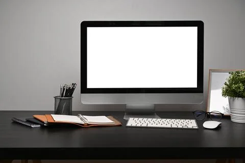 Front view computer with empty display on black table. Stock Photos