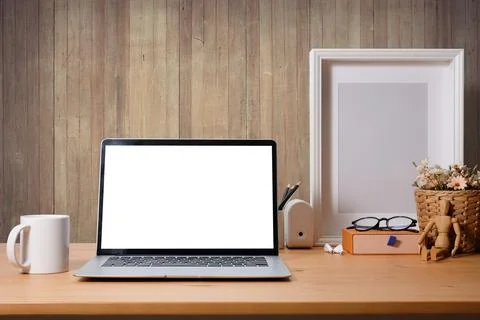 Front view computer laptop with empty display on wooden table. Stock Photos