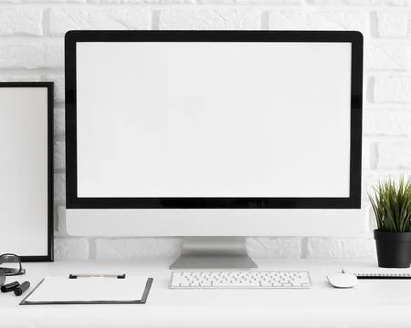 Front view computer screen office workspace with keyboard clipboard 스톡 사진