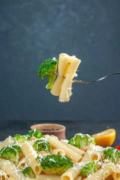 Front view cooked pasta with broccoli on gray background pepper color food .. Stock Photos