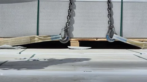 Front View of Crane Starting to Lift Heavy Load at Construction Site Stock Footage 334550997