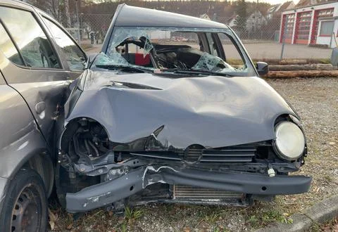 Front view of a crashed, damaged passenger car. Stock Photos