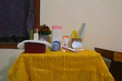 Front View of Crowded Beauty Table with Skincare and Cosmetics Stock Photos